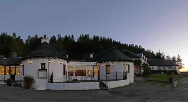 "Elegant round event space at The Pierhouse Hotel with outdoor terrace for gatherings."