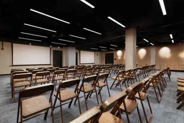 Industrial conference space at Barcelo Warsaw with theater seating for corporate seminars.