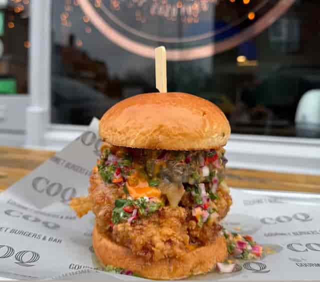 Gourmet burger with crispy chicken at Coq Bristol venue for events and meetings.