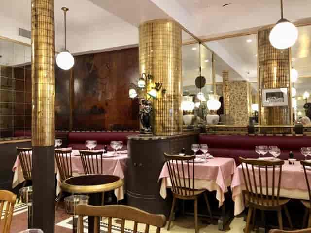 La Poule au Pot restaurant interior with linen tablecloths for upscale private group dining events.