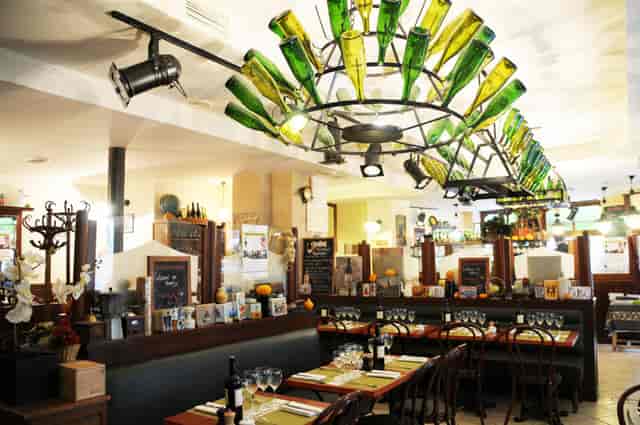 Private Salon, Le Mesturet - Unique bottle chandelier, ideal for casual meetings or events.