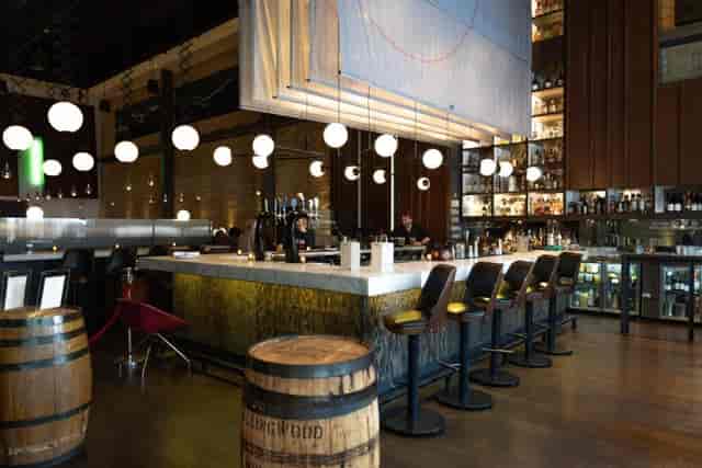 Industrial-chic Green Room at The Carbon Bar for upscale networking and private cocktail events.