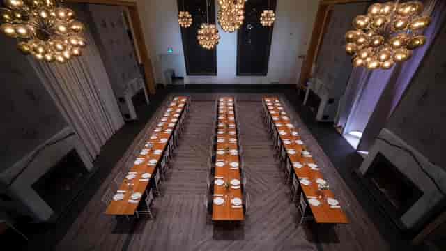 Atrium at Terroni: elegant dining space with long tables for corporate events and celebrations.