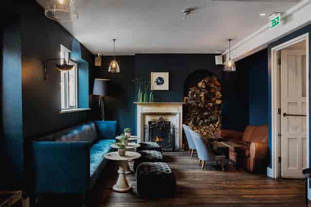 Upstairs at No 32 Old Town: cozy lounge with fireplace for networking events and receptions.