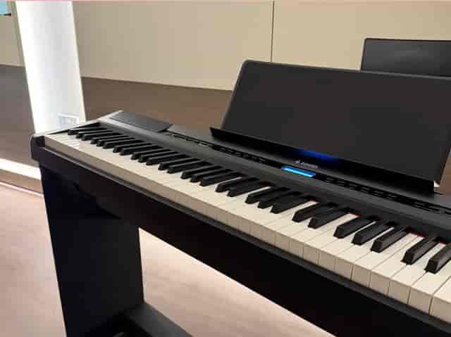 Sleek digital piano in Tails Studio for sophisticated event ambiance and live entertainment.