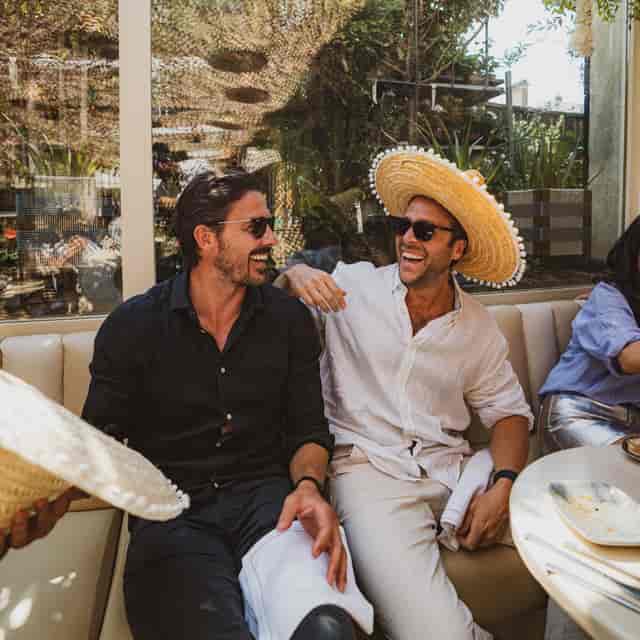 "Two smiling individuals at The Terrace in Mezcalito Chelsea, perfect for networking events."
