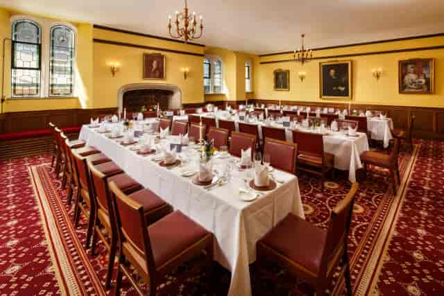 U-shaped banquet table in St John’s College Hall for formal meetings and private dining.