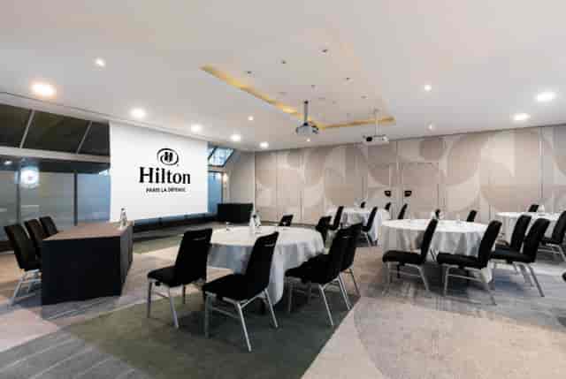Meeting room at Hilton Paris La Défense with classroom seating for corporate workshops and training.