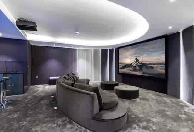 Modern meeting space at Radlett Eco Mansion with curved seating, perfect for team retreats.