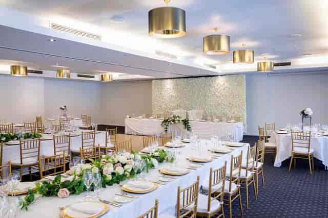 Southern Cross Gala ballroom with floral backdrop for weddings and corporate events.