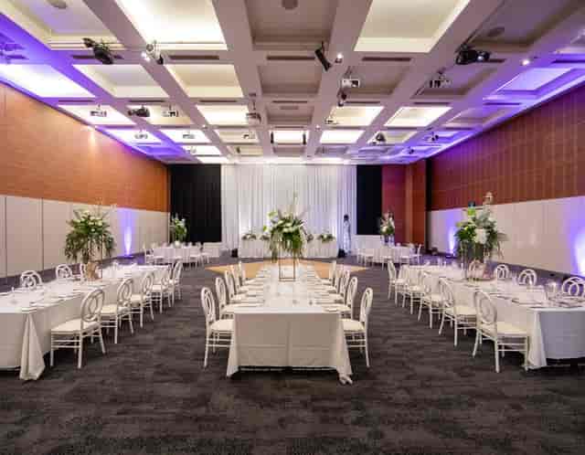 Ballroom at Esplanade Hotel Fremantle with banquet seating for corporate dinners and gala events.