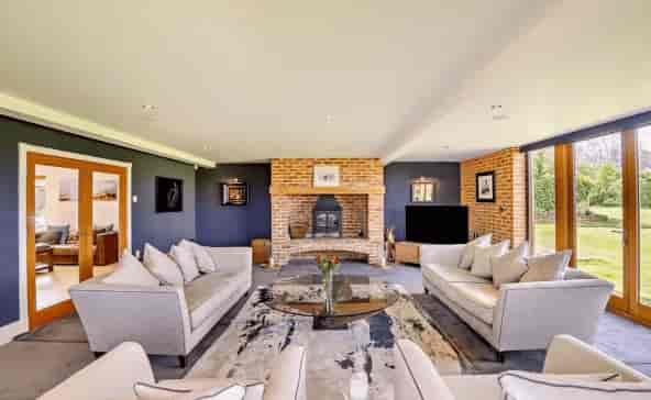 Modern meeting space with a cozy fireplace, ideal for brainstorming sessions and workshops.