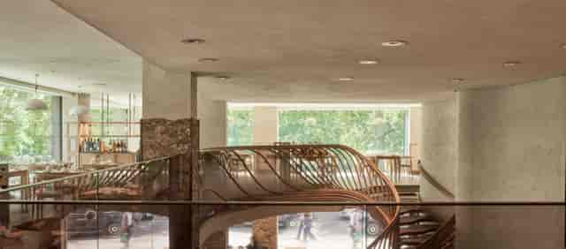 Modern event venue Mezzanine in Hide with a wooden staircase, ideal for meetings and gatherings.