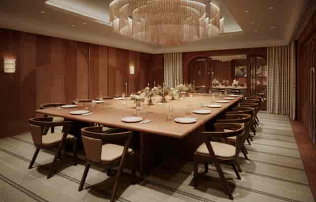 Talland Room at The Newman hotel, elegant boardroom with chandelier for intimate events.