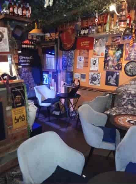 Cozy venue with vibrant art, perfect for informal meetings and social gatherings.