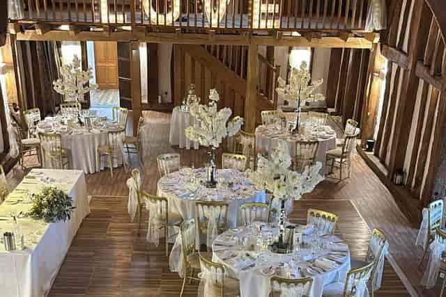 Elegant event venue with round tables, ideal for weddings and upscale gatherings.