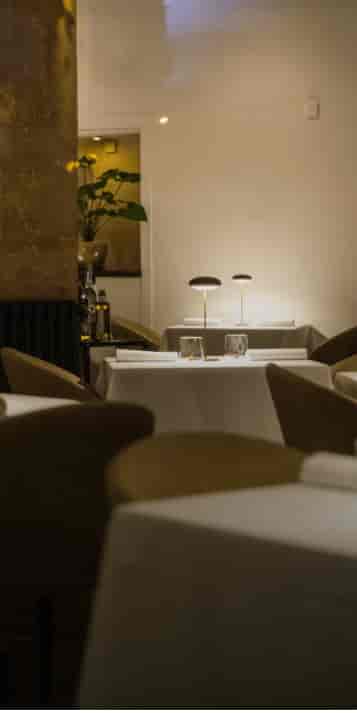 Elegant dining setup at Amâlia Restaurant for corporate meetings and intimate events.