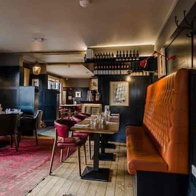 Private dining area at The Lighthouse with banquette seating for intimate events and networking.