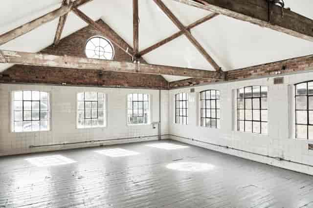Spacious Forest Hill Depot venue with exposed beams, perfect for workshops and meetings.