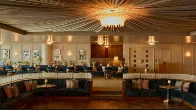 Elegant event space in White City House with plush seating, ideal for meetings and receptions.