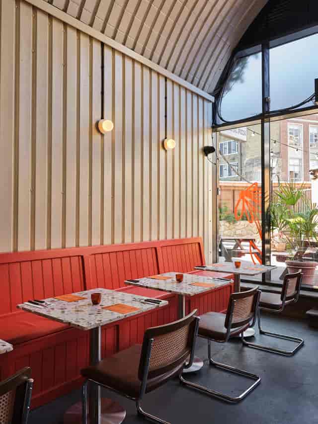 Modern dining space at SpringSt Pizza, inviting atmosphere for gatherings and networking.