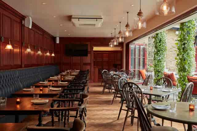 Elegant Green Room at The Hound, ideal for intimate meetings and workshops.