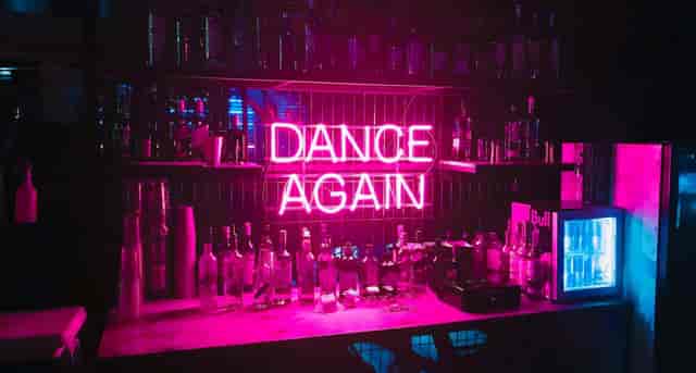 Neon-lit bar in Stealth's Room 1, perfect for nightlife events and celebrations.