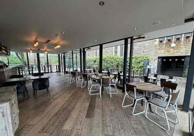 Modern event space Mezzanine at Pitcher & Piano, perfect for networking and casual gatherings.