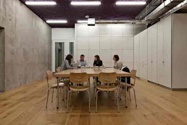 Modern meeting room with wooden table in Nottingham Contemporary, perfect for collaborations.