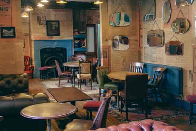 Cozy Chesterfield Lounge at Angel Microbrewery for intimate gatherings and meetings.