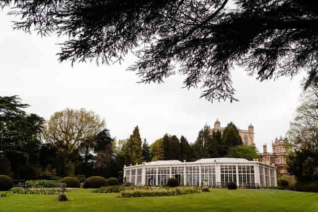 Back Lawn Wollaton Hall: elegant glass conservatory for events in landscaped garden.