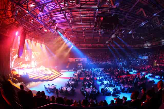 Main Arena at Motorpoint Nottingham gala: large-scale plenary event with dynamic stage lighting.