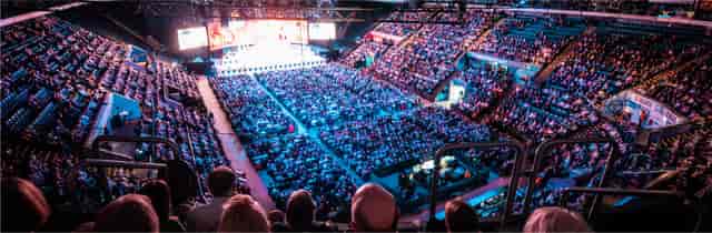 Packed National Ice Centre in Nottingham during a vibrant performance event.