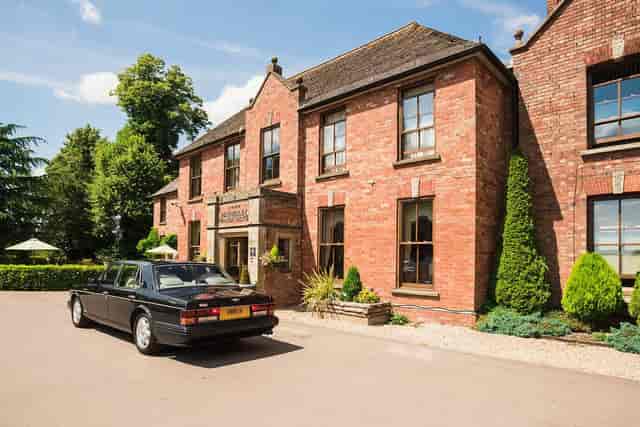 Moat Suite at Hatherley Manor: Luxury boardroom for intimate executive retreats and meetings.