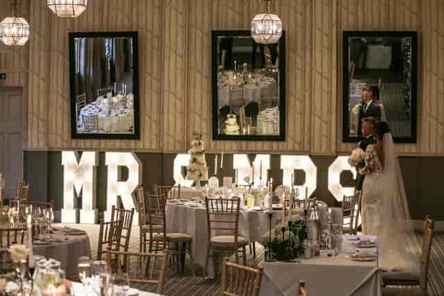 Westonbirt Room wedding reception with elegant tables and romantic decor at Hare & Hounds Hotel.