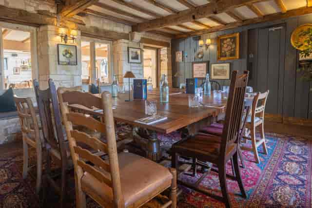 Intimate meeting space with rustic table and chairs at The Frogmill for workshops.