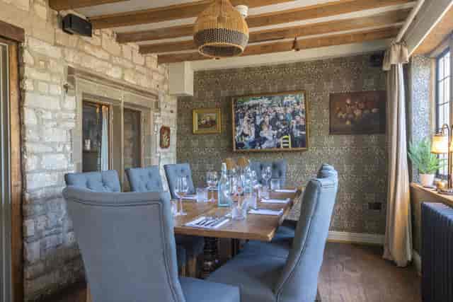 Intimate bar at The Frogmill with rustic stone walls, ideal for meetings and dinners.