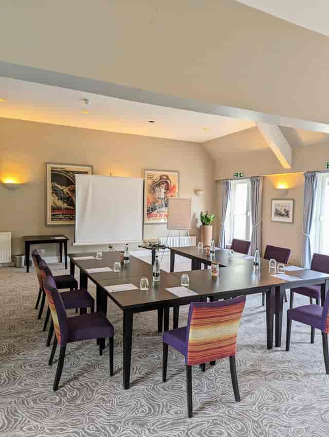 Terrace Suite meeting room at Sudbury House Hotel, with central table and professional setup.