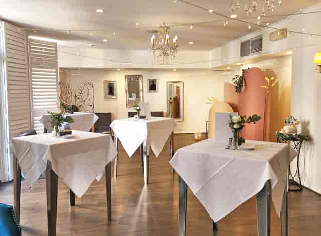 Henley Room cocktail setup with high-top tables for networking events and social mixers.