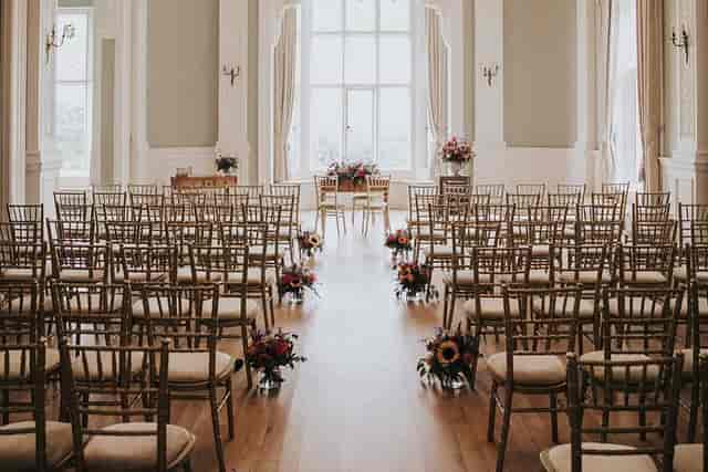 Frensham Hall ceremony room with gold Chiavari chairs for luxury weddings and corporate events.