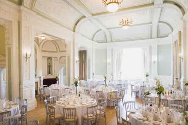 Frensham Hall ballroom with round tables for elegant gala and wedding event hosting.