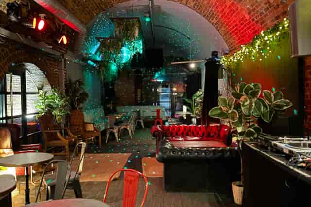 Event space in Rolling Stock London with cozy seating and vibrant décor for gatherings.