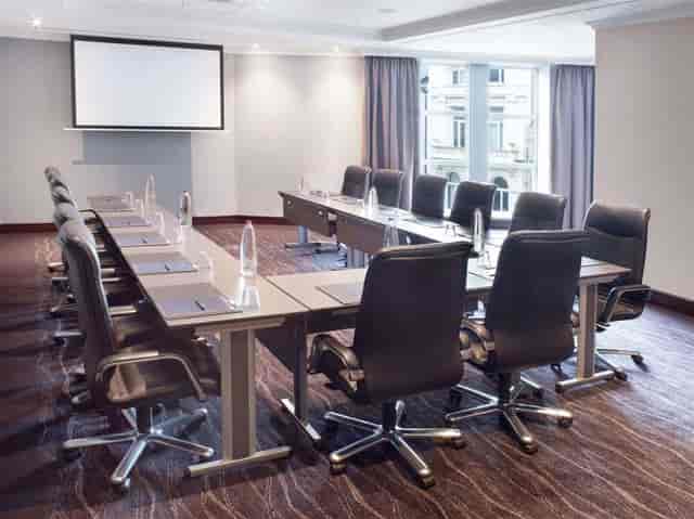 Groenplaats Room at Hilton Antwerp: modern meeting space with natural light for professional events.