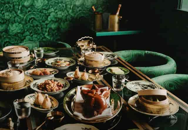Maison Estelle dinner setup with dim sum spread for intimate corporate incentive events.