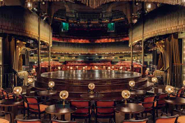 Haus of Cabaret private hire venue with circular stage for immersive keynote and dinner events.