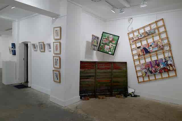 Creative art exhibition space with hanging artwork at Espacio Gallery. Ideal for networking events.