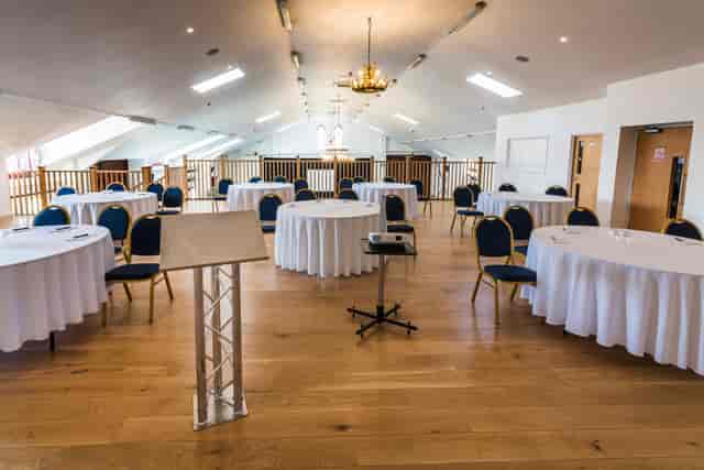 Hayloft Gallery: natural light, round tables, conference, event