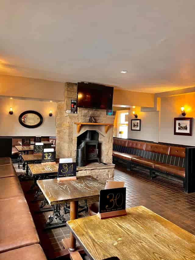 Conservatory dining, fireplace, networking event