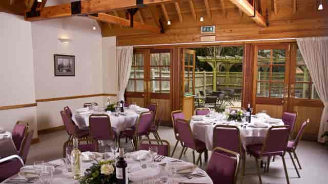 Elegant dining venue with circular tables, perfect for receptions or gatherings.