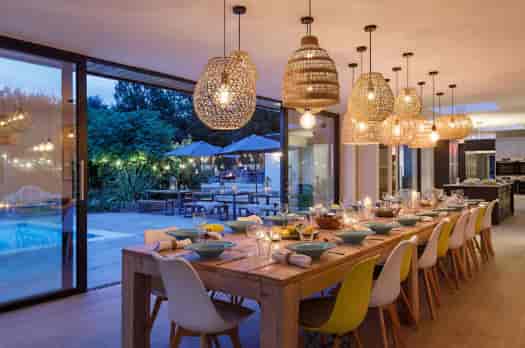 Modern private villa dining space for corporate retreats and upscale networking events.